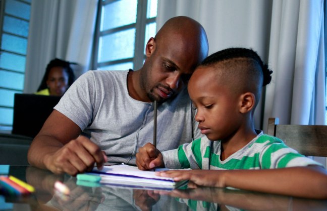 Father and son homeschooling math