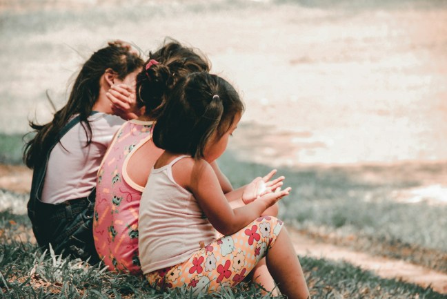 photo of three young girls talking about numbers