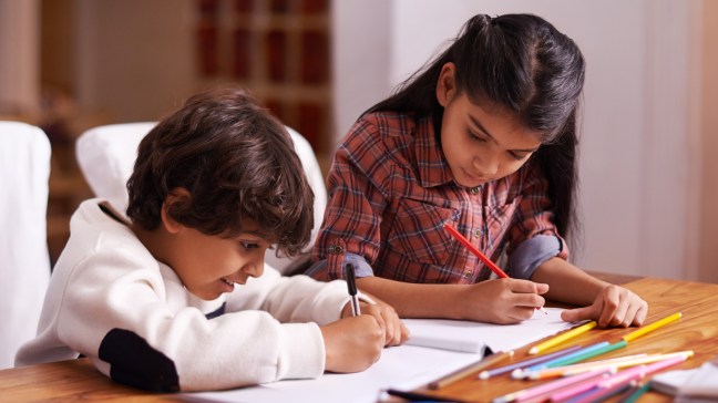 brother and sister journaling together