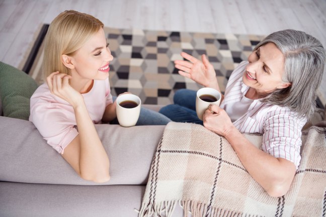 Two women chatting over tea