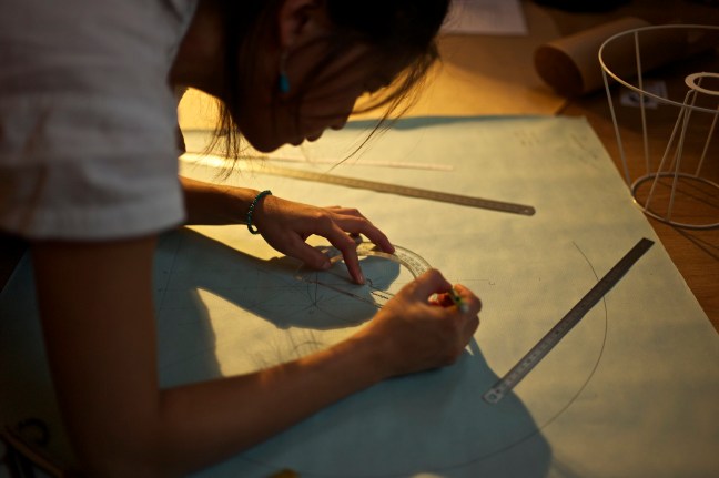 student using drafting tools