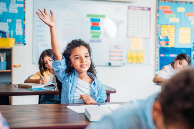 girl raising hand in math class