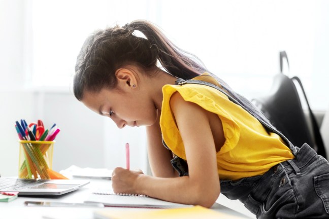 young girl doing math homework