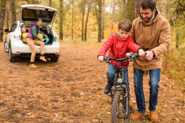 boy learning to ride a bike